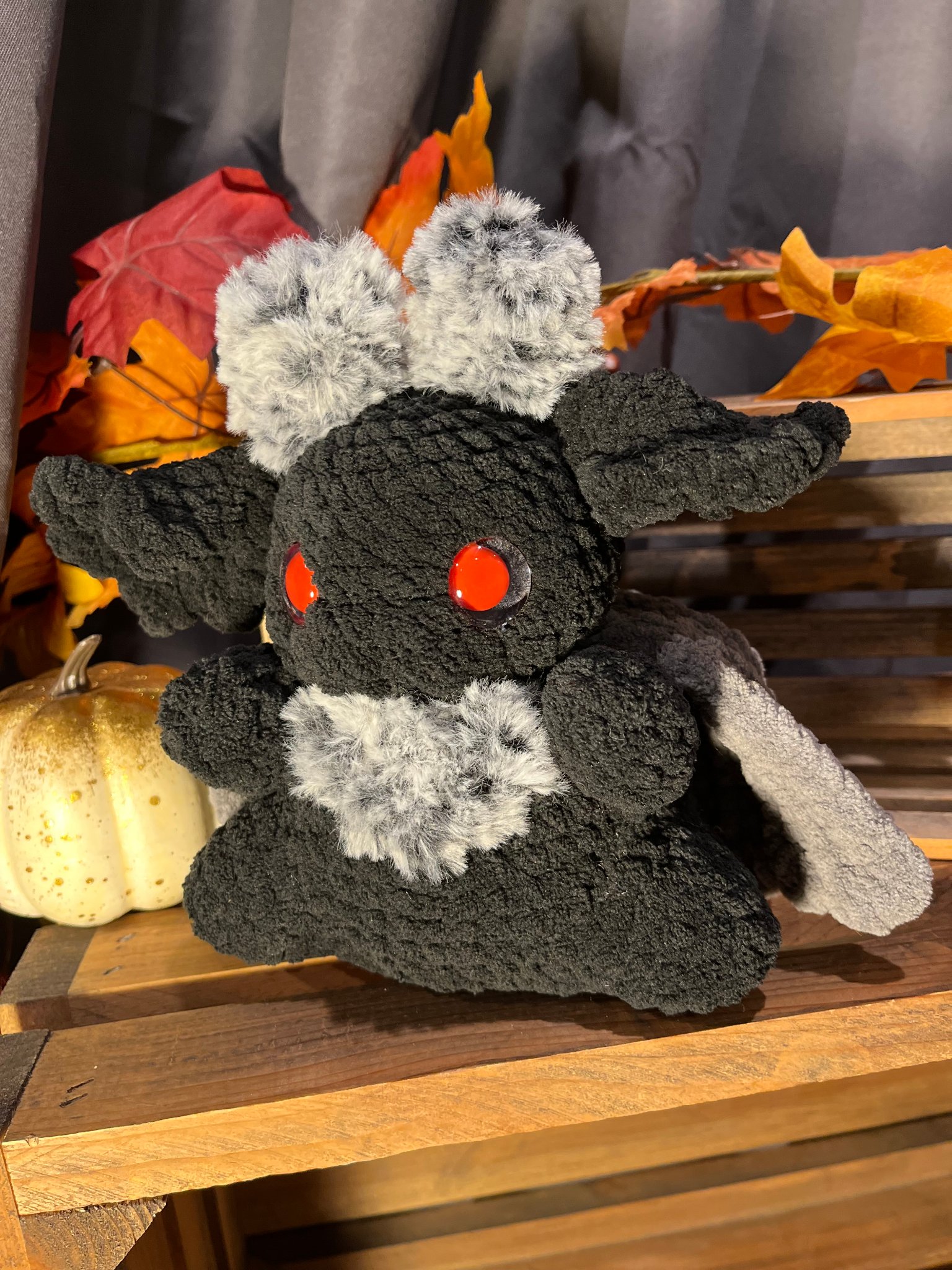 Handcrafted black crochet moth plushie